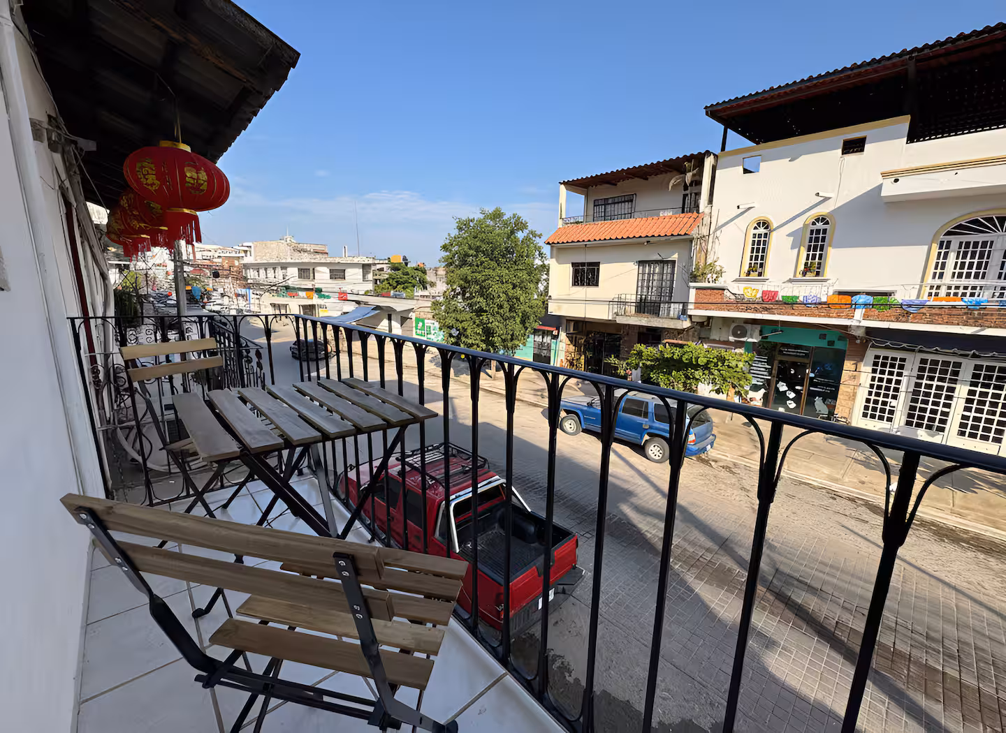Private balcony overlooking the neighborhood street