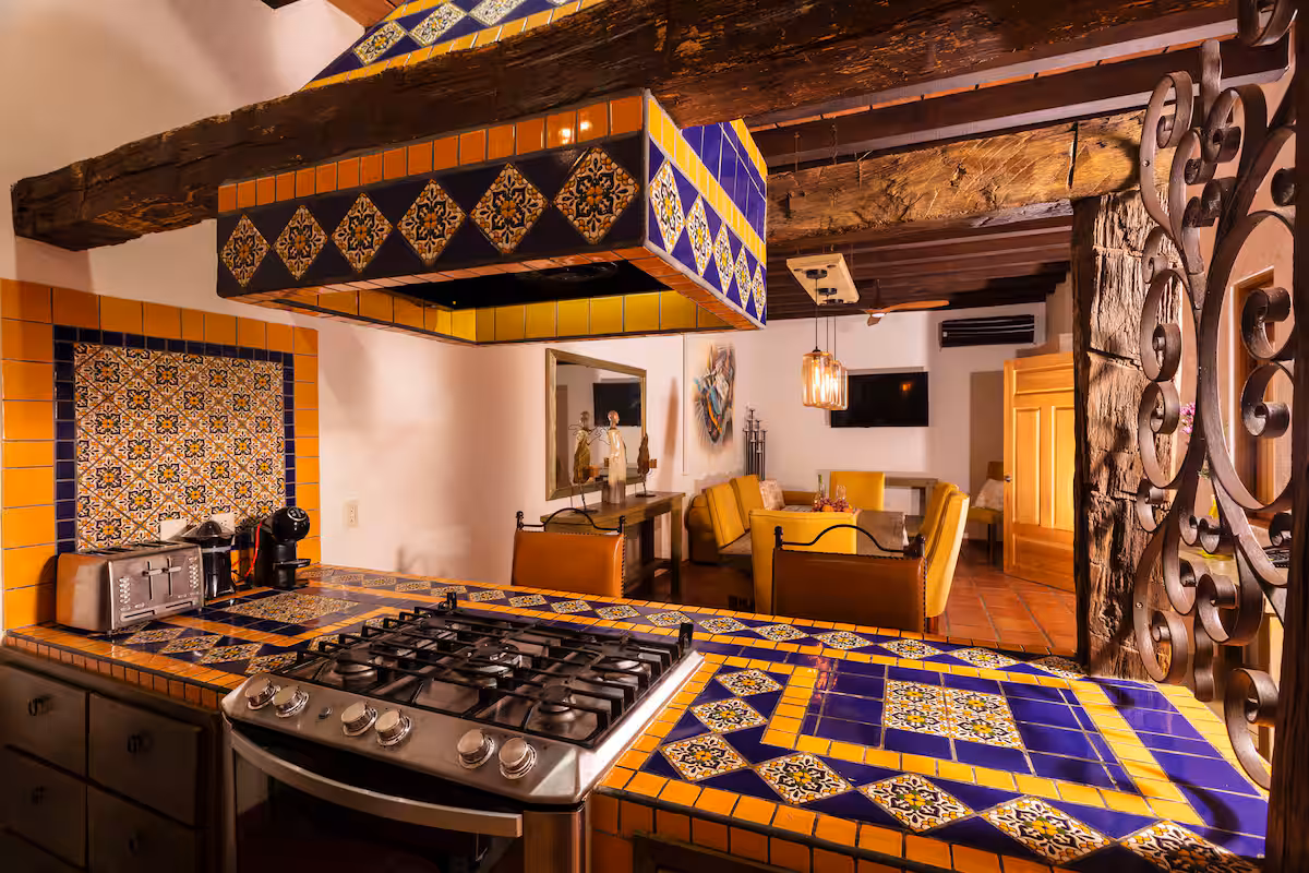 Gas stove and blue-and-yellow tile in the kitchen