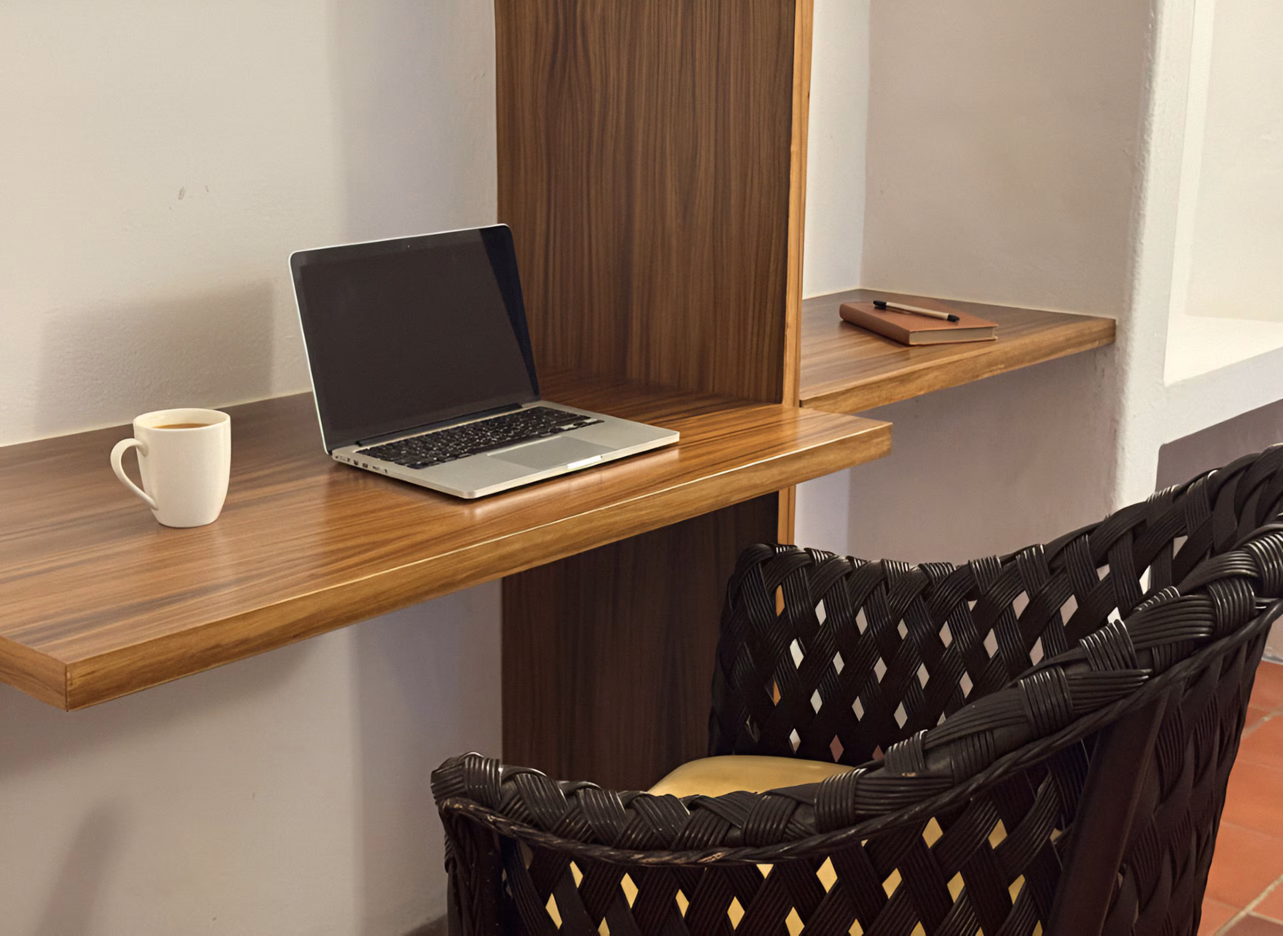 Desk and chair beside the bedroom window